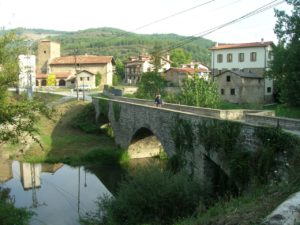 Stage 2: From Roncesvalles To Pamplona 15 Pilgrim Passing Through Bandidos Bridge In Larrasoaña
